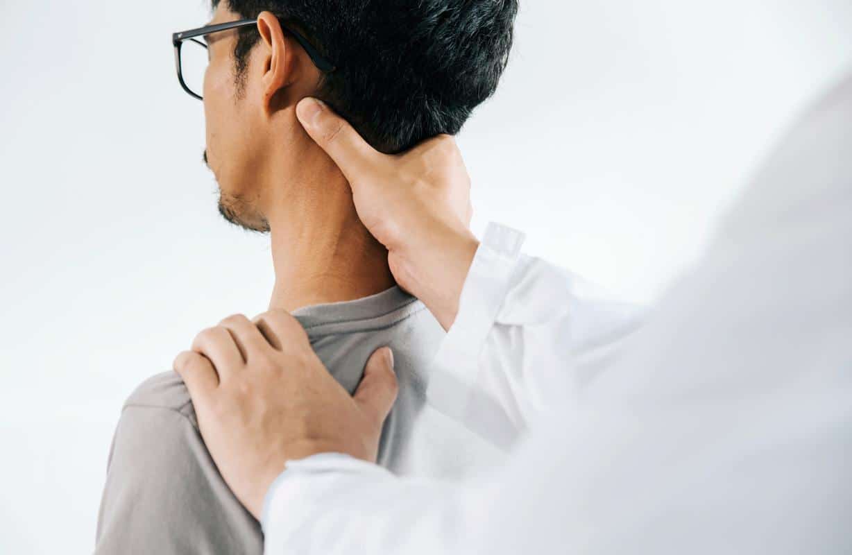 Chiropractor-adjustment-man-neck-patient-2 Chiropractic diagnostics male patient neck adjustment chiropractic care pain relief